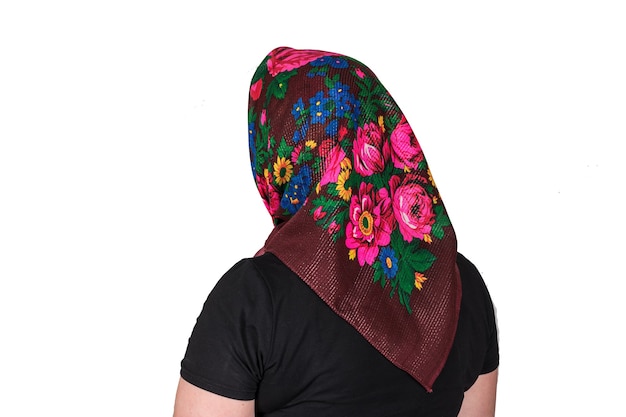 Colorful, multi-colored scarf on the head of a female model. Isolated