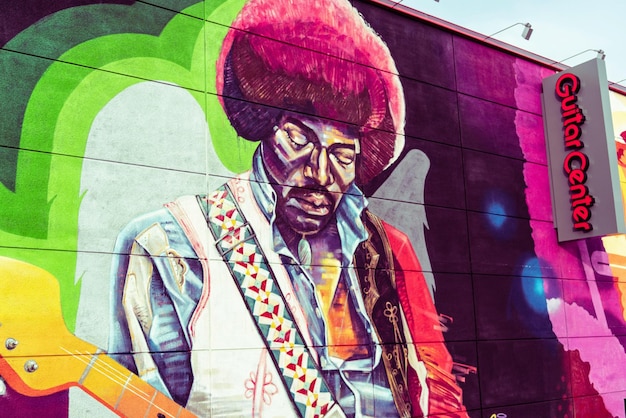 a colorful mural of a man playing a saxophone