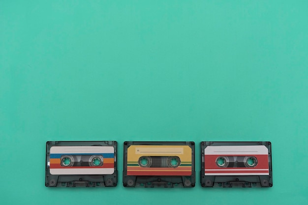 Colorful music cassette on green background