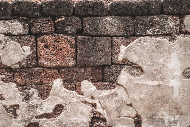 Photo colorful natural stone wall with cement texture background