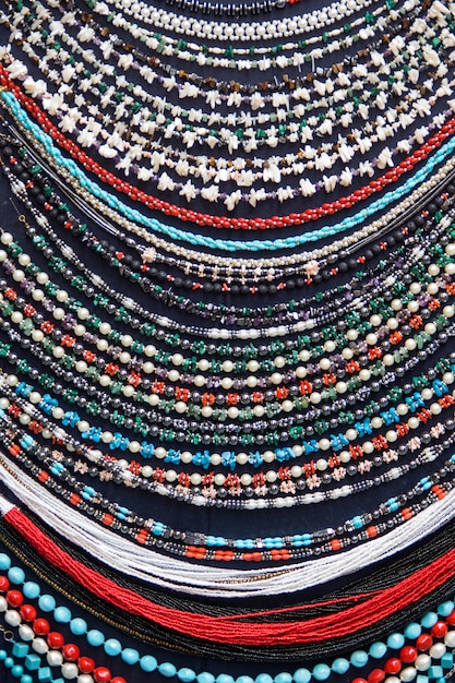 Colorful necklaces on a market close up