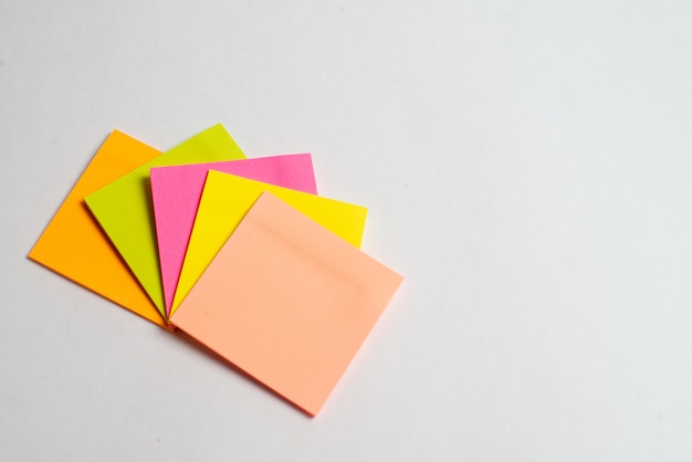 Colorful note sticks on white background