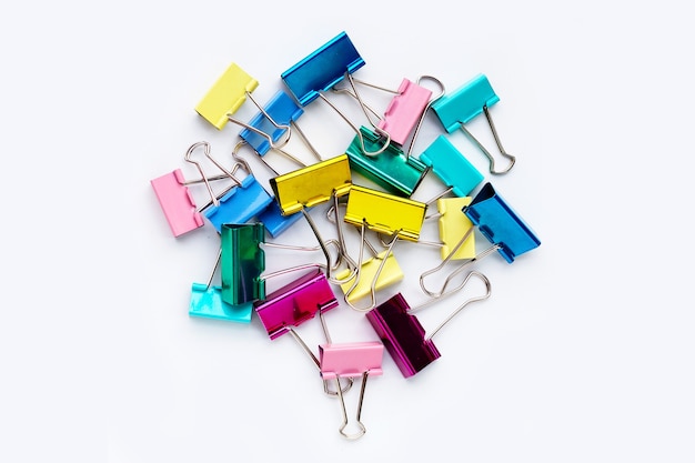 Colorful office paper clips on white background.