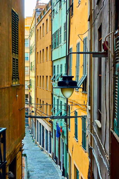 Colorful old narrow side street in  Genoa city, Italy