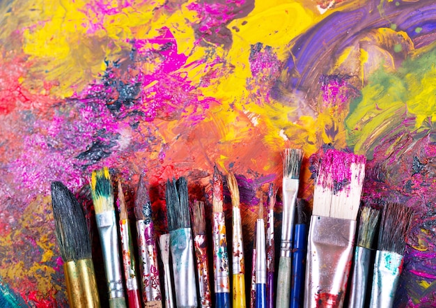 Colorful paint brushes on a palette