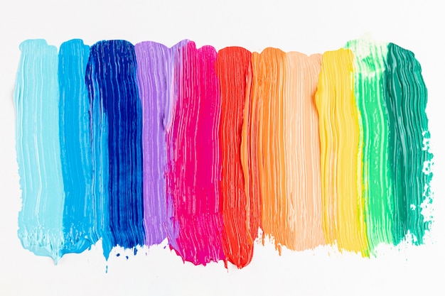 Photo colorful paint strokes on white background