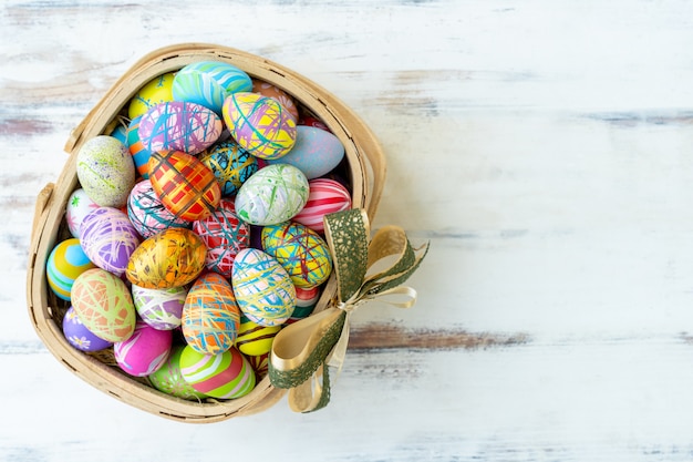 Colorful painted easter eggs on the basket