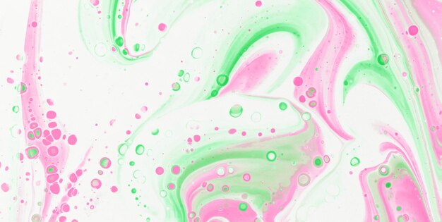 A colorful painting with pink and green swirls.