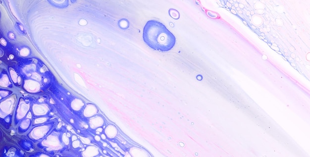 A colorful painting with a purple background and blue circles.