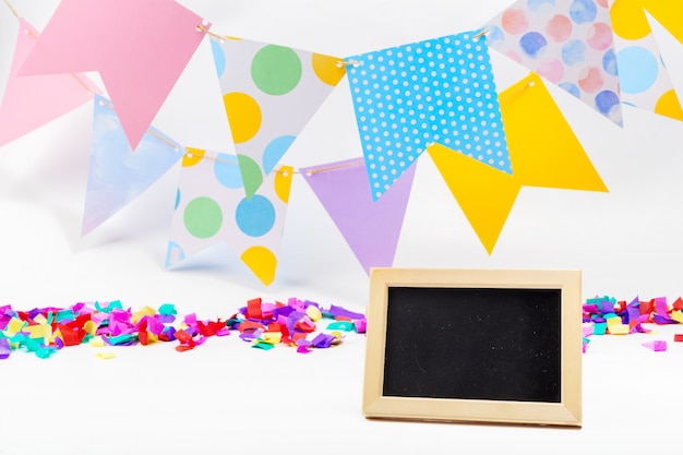 Colorful paper bunting party flags isolated on white background