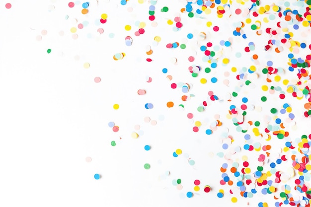 colorful paper confetti on a white
