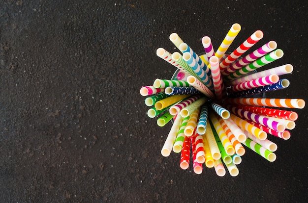 Colorful paper straws of different colors for cocktails and drinks