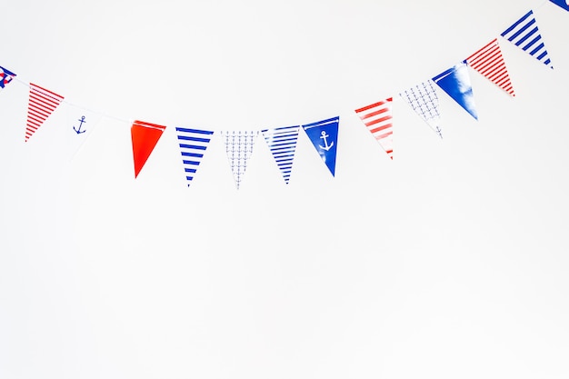 Photo colorful party flags made of paper on white background