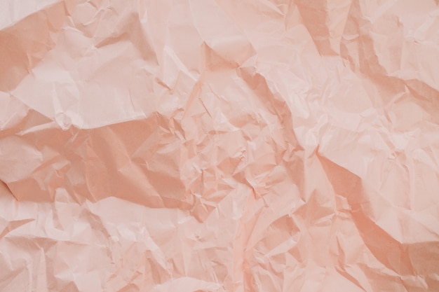 Красочная персиковая текстура мятой бумаги