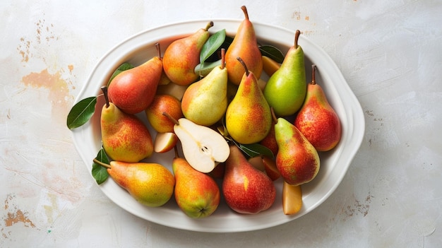 Colorful pears and slices in the dish on a white background