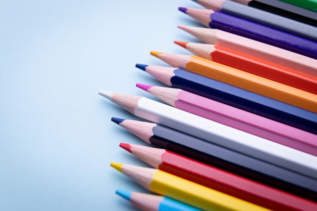 Colorful pencil set on blue background