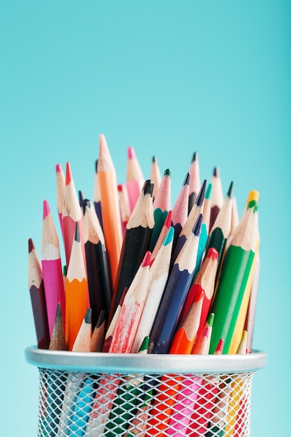 Colorful pencils in a metal jar