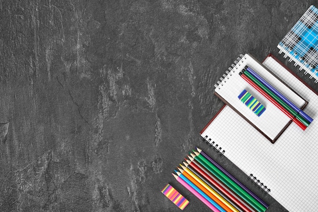 Colorful pencils and notebooks