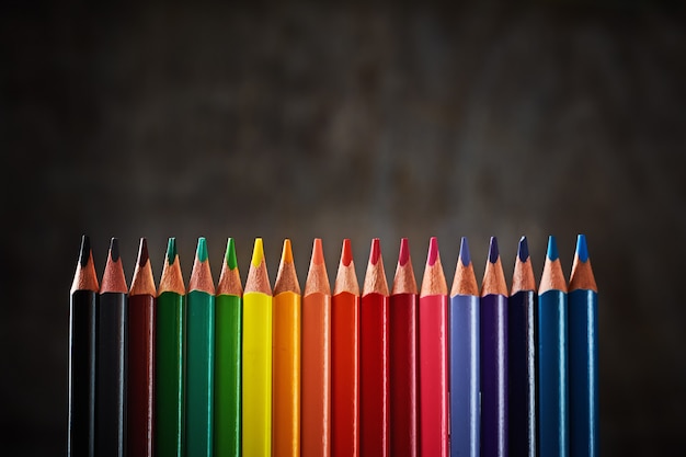 Colorful pencils in row 