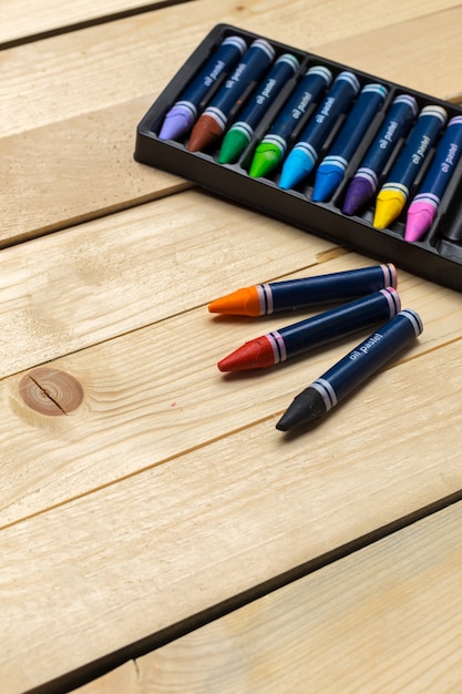 Colorful pencils on the wooden table