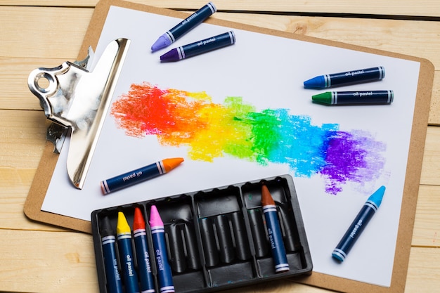 Colorful pencils on the wooden table