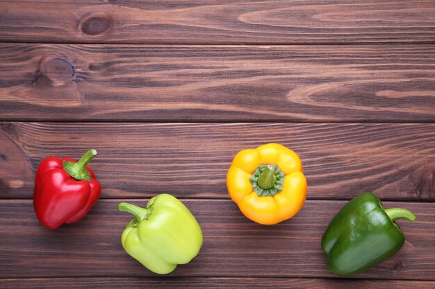 Colorful pepper with copy space on a brown background