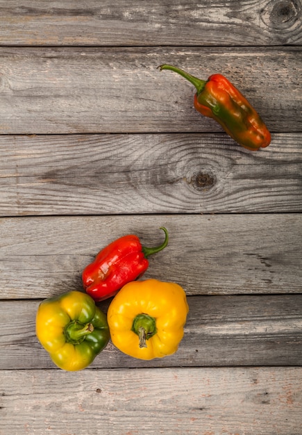 colorful Peppers on wood table