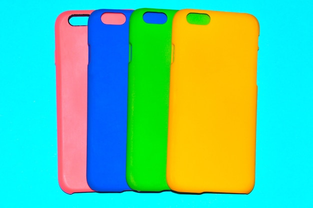 Colorful phone cases on a blue background