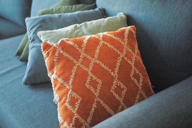 Colorful pillows lined up on a sofa