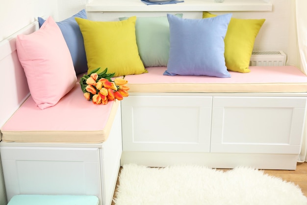 Colorful pillows on nook furniture