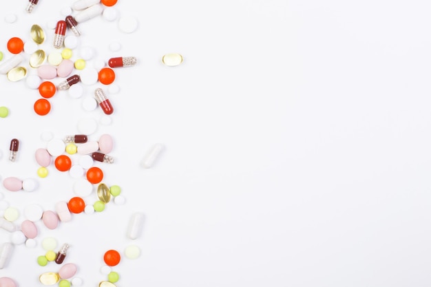 Colorful pills on blank surface