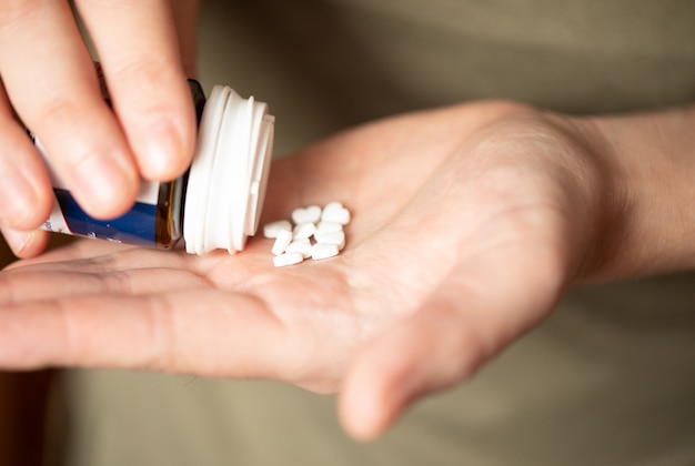 colorful pills and medicines in the hand