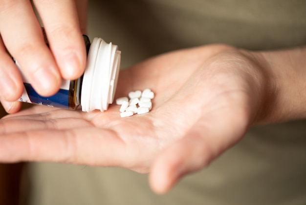 Colorful pills and medicines in the hand