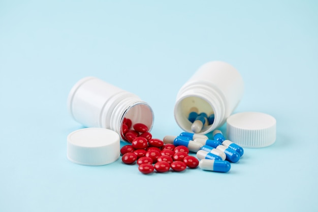 Colorful pills and plastic bottle