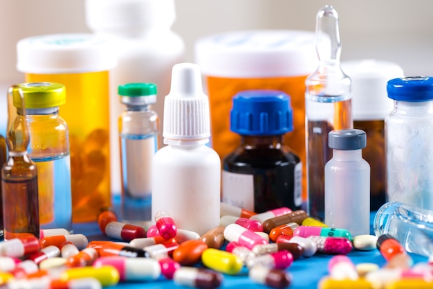 Colorful pills and tablets on background