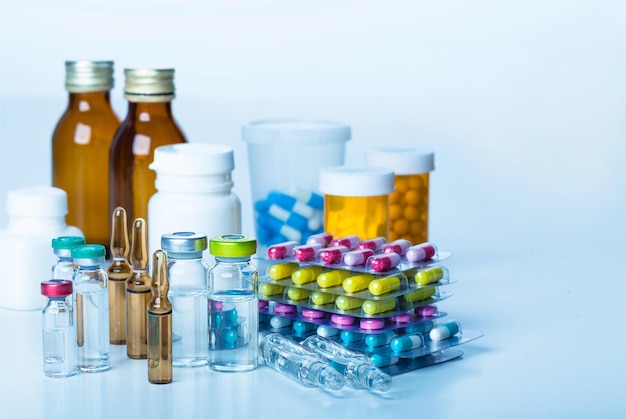 Colorful pills and tablets on background