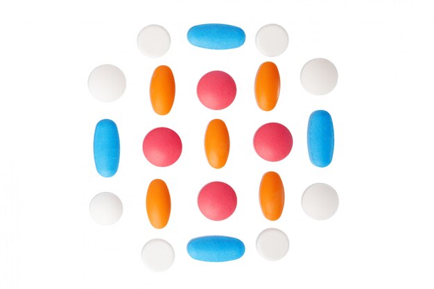 Colorful pills on white background