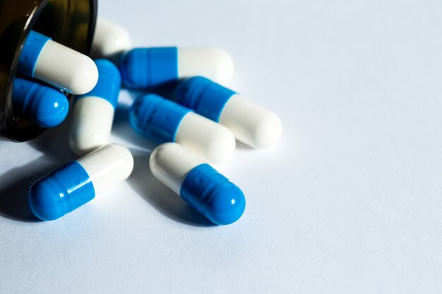 Colorful pills on white background