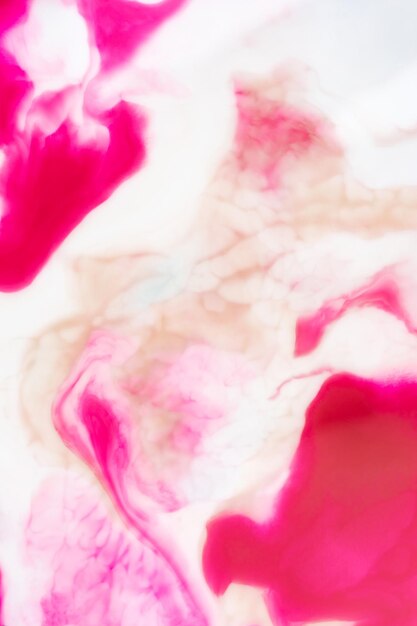 colorful pink geeen blue mixes inks liquid texture pink and blue paint in water