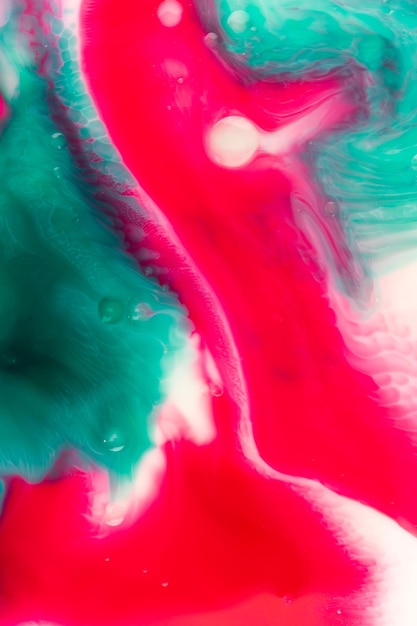 화려한 분홍색 geeen 파란색은 잉크 액체 질감 분홍색과 파란색 페인트를 물에 혼합합니다.