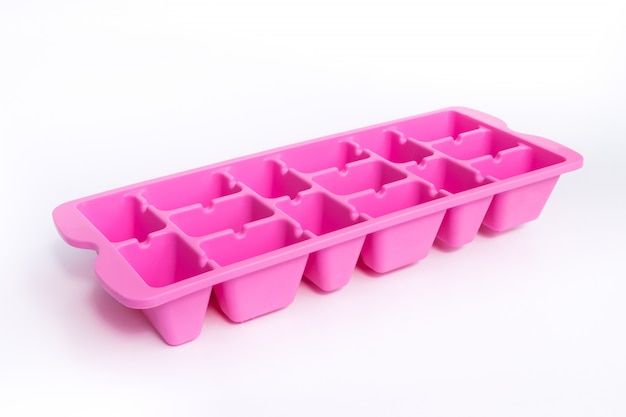 Colorful Pink ice tray a device for Ice isolated on white 