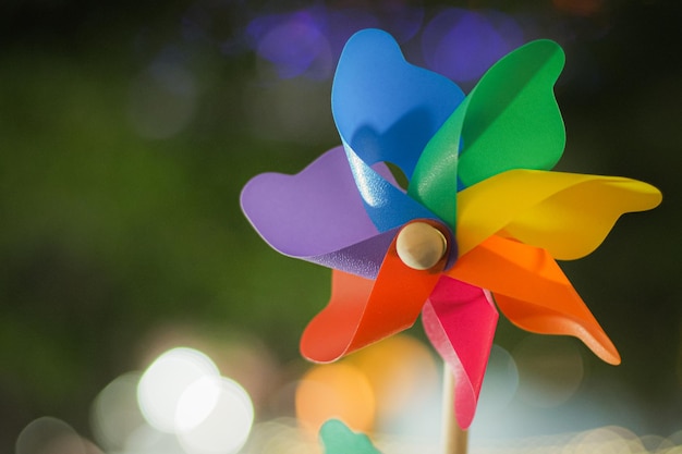 Colorful pinwheel with golden bokeh background