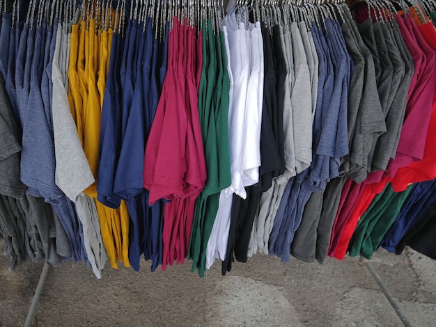 Colorful Plain Casual T-Shirts Hanging on the Rack