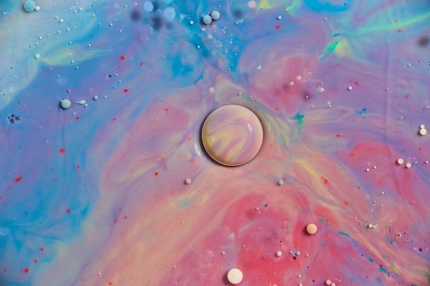 Красочная планетарная сфера абстрактное космическое искусство из нефти и молока фонового актива