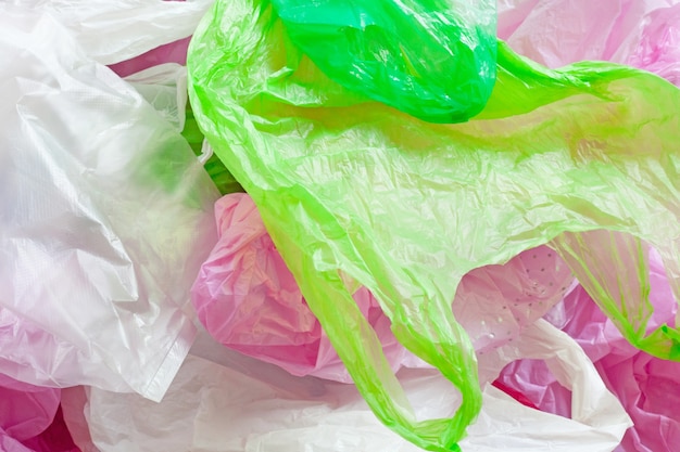 Colorful plastic bag on cement background