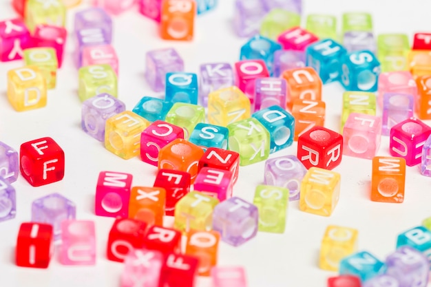 Colorful plastic beads with letters