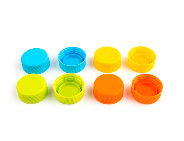 Colorful Plastic bottle caps on white background. selective focus