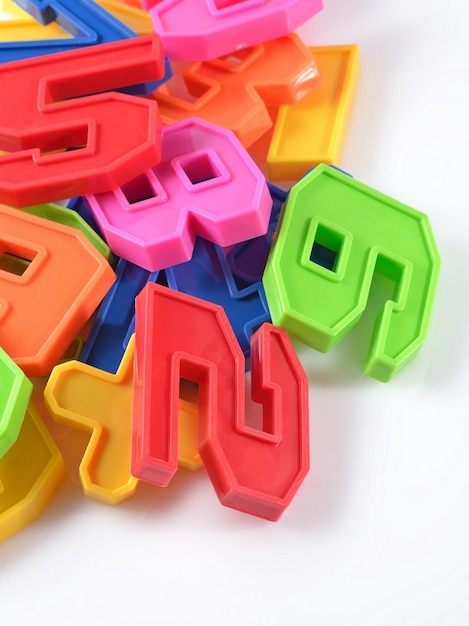 Colorful plastic numbers on a white