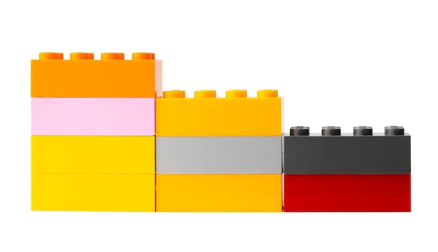 Colorful plastic toy building blocks isolated on white