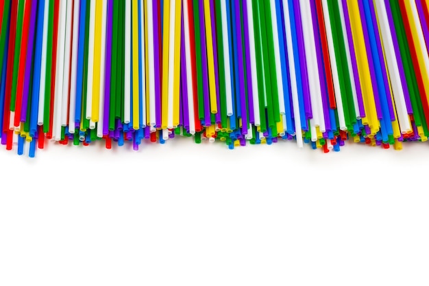 Colorful plastic tubules isolated on white. Copy space.